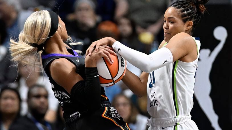 Minnesota Lynx forward Napheesa Collier pressures Connecticut Sun guard DiJonai Carrington, left, during the first half of a WNBA basketball semifinal game, Friday, Oct. 4, 2024, in Uncasville, Conn. (AP Photo/Jessica Hill)