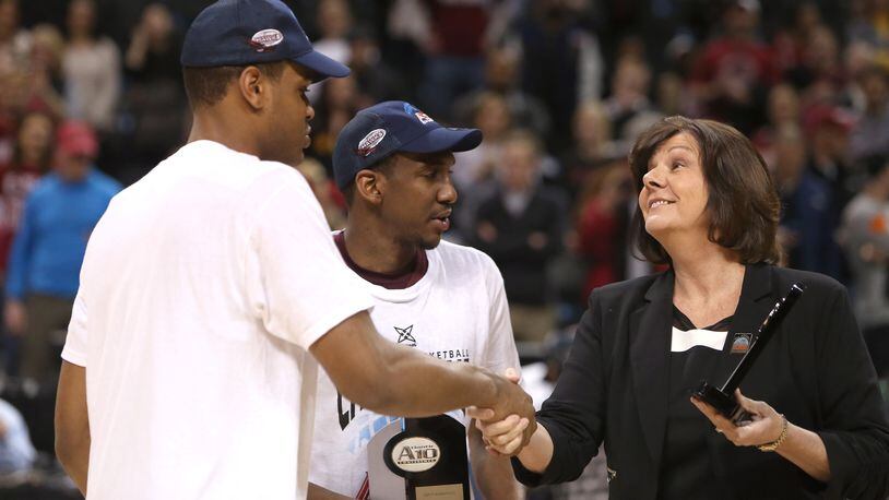 Ronald Roberts. Jr. and Langston Galloway, of the Saint Joseph's Hawks, are presented with A-10 All-Championship Team Awards by Atlantic 10 Commissioner Bernadette V. McGlade after defeating the Virginia Commonwealth Rams during the Championship game of the 2014 Atlantic 10 Men's Basketball Tournament at Barclays Center on March 16, 2014 in the Brooklyn borough of New York City.  (Photo by Mike Lawrie/Getty Images)