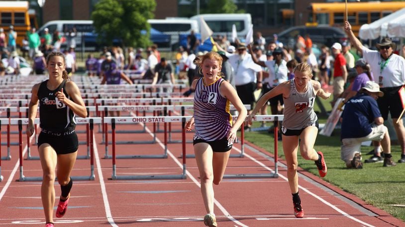 Dayton Christian's Aurora Schubert (center) runs to a fifth-place finish in the 100-meter hurdles at the Division III state track meet on Saturday, June 3, 2023, at Jesse Owens Memorial Stadium in Columbus, Ohio. David Jablonski/Staff