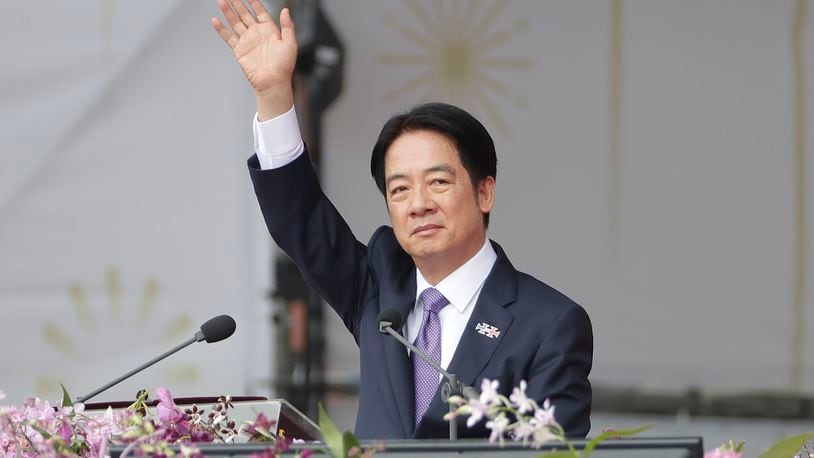 Taiwanese President Lai Ching-te waves during National Day celebrations in front of the Presidential Building in Taipei, Taiwan, Thursday, Oct. 10, 2024. (AP Photo/Chiang Ying-ying)