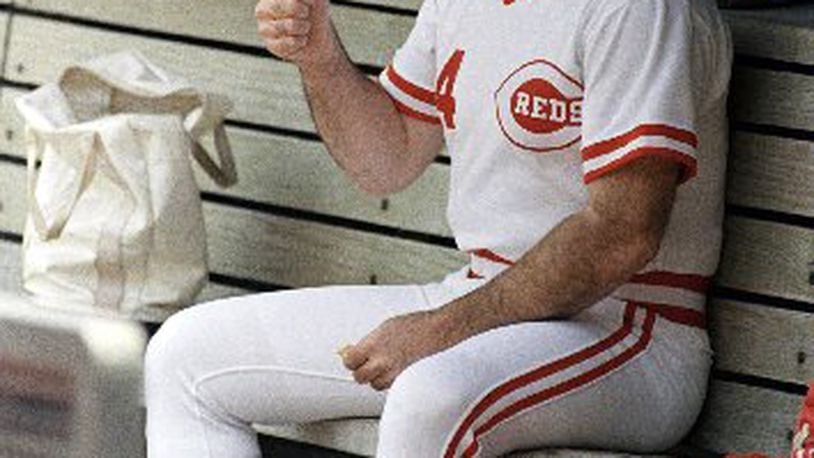 In this June 24, 1989, file photo, Cincinnati Reds manager Pete Rose gives a thumbs up sign while sitting in the dugout at Riverfront Stadium in Cincinnati during a baseball game against the Los Angeles Dodgers. . ESPN says it obtained a notebook that shows Rose bet on Reds games during his last season as an active player in 1986. The career hits leader agreed to a lifetime ban from baseball in 1989 after an investigation by John Dowd, a lawyer retained by Major League Baseball, concluded he bet on the Reds to win from 1985-87, during his time as a player and manager. (AP Photo/Rob Burns, File)