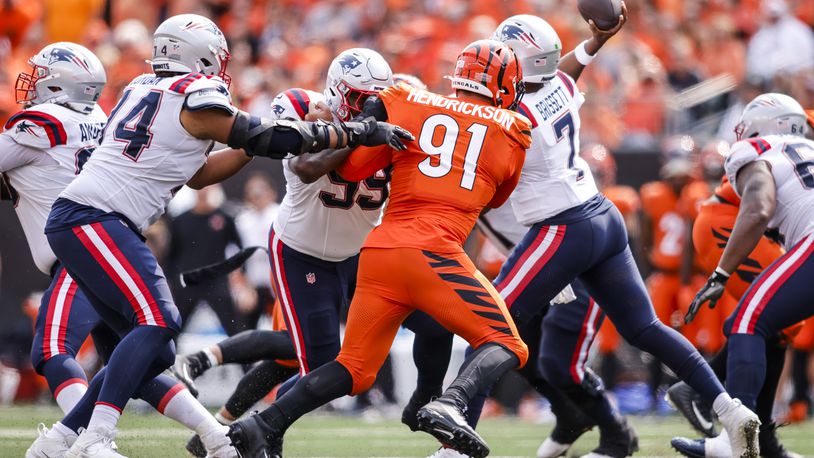 Bengals defensive end Trey Hendrickson pressures Patriots quarterback Jacoby Brissett during their 16-10 loss to New England Patriots Sunday, Sept. 8, 2024 at Paycor Stadium in Cincinnati. NICK GRAHAM/STAFF