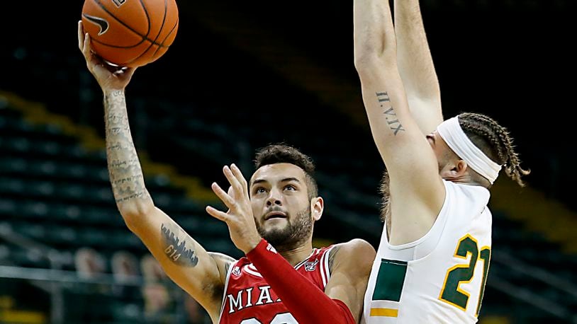 Miami forward Elijah McNamara shoots against Wright State forward Grant Basile during a mens basketball game at the Nutter Center in Fairborn Saturday, Dec. 5, 2020. E.L. Hubbard/CONTRIBUTED