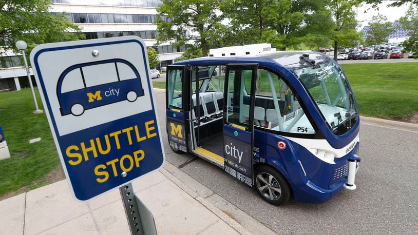 FILE - A Mcity driverless shuttle makes a stop on June 4, 2018 at the University of Michigan in Ann Arbor, Mich. (AP Photo/Paul Sancya)