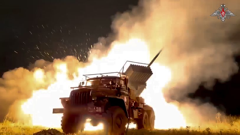 In this photo taken from video released by Russian Defense Ministry Press Service on Sunday, Oct. 6, 2024, a Russian Army "Grad" self-propelled 122 mm multiple rocket launcher fires rockets toward Ukrainian position at an undisclosed location. (Russian Defense Ministry Press Service photo via AP)