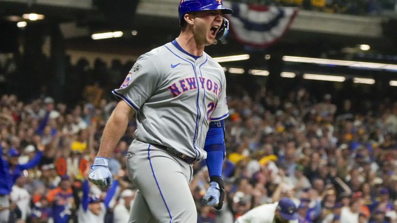 New York Mets' Pete Alonso reacts after hitting a three-run home run during the ninth inning of Game 3 of a National League wild card baseball game against the Milwaukee Brewers Thursday, Oct. 3, 2024, in Milwaukee. (AP Photo/Morry Gash)