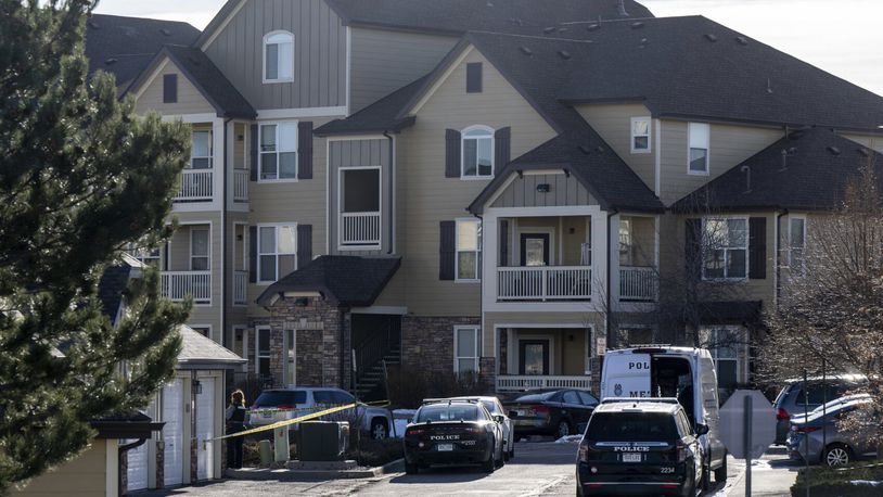 Colorado Springs Police Department investigators and officers work on the scene of a burglary that resulted in the deaths of two people at the Palomino Ranch apartment complex on Tuesday, Dec. 19, 2023 in Colorado Springs, Colo. (Parker Seibold/The Gazette via AP)