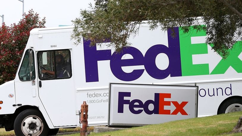 A FedEx truck leaves a distribution center on March 20, 2013 in San Rafael, California.