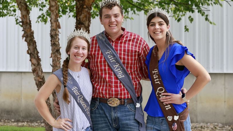 Butler County Fair Queen runner up LeAnn Niederman, left, King Ryland Beckner, middle, and Queen Alyssa Thompson will make appearances at many events during Butler County Fair in Hamilton. NICK GRAHAM/STAFF