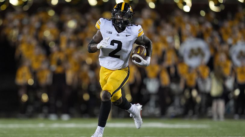 Iowa running back Kaleb Johnson runs with the ball during the second half of an NCAA college football game against Minnesota, Saturday, Sept. 21, 2024, in Minneapolis. (AP Photo/Abbie Parr)