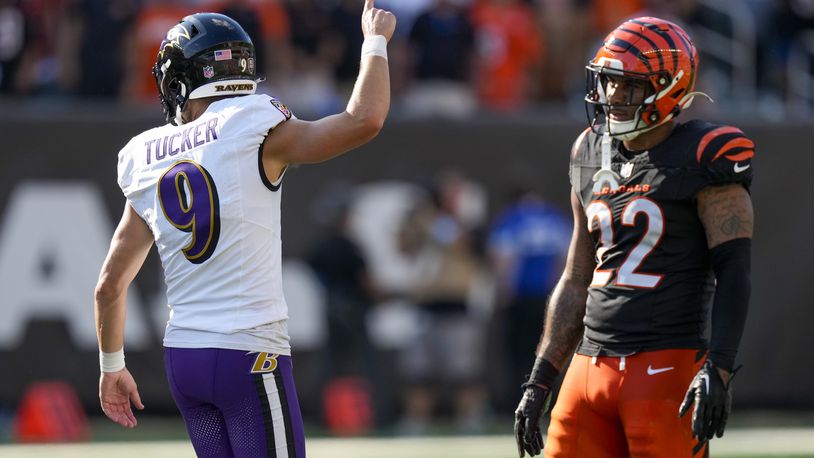 Baltimore Ravens place kicker Justin Tucker (9) gestures in front of Cincinnati Bengals safety Geno Stone (22) after kicking a field goal to tie the score 38-38 late in the second half of an NFL football game, Sunday, Oct. 6, 2024, in Cincinnati. (AP Photo/Carolyn Kaster)