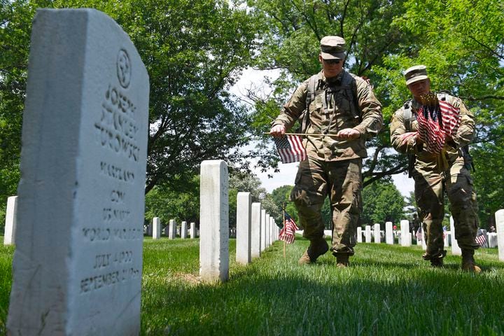 Soldiers place flags at Arlington National Cemetery for Memorial Day