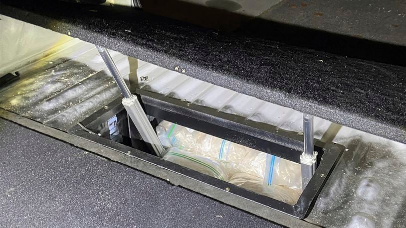 In this undated photo provided by the Australian Federal Police, illicit drugs are found in a concealed compartment in a vehicle after police have revealed on Wednesday, Sept. 18, 2024, that they have penetrated an encrypted global communications app developed for criminals called Ghost, leading to dozens of arrests. (Australian Federal Police via AP)