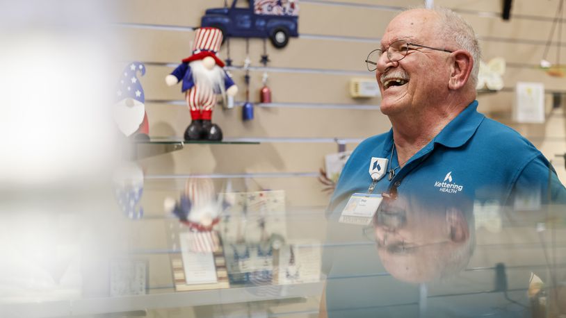 Skip Batten carries on his late wife's legacy by volunteering at the Wishing Well Gift Shop at Kettering Health Hamilton. His wife, Marie, volunteered at the gift shop and Skip now volunteers at the same place several days a week. NICK GRAHAM/STAFF