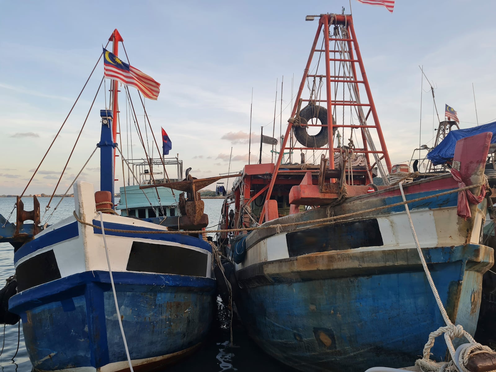 This undated photo shows Vietnamese owned fishing vessels that are registered to a Malaysian company docked at a Malaysian port. (Panthera/Sunway University via AP)