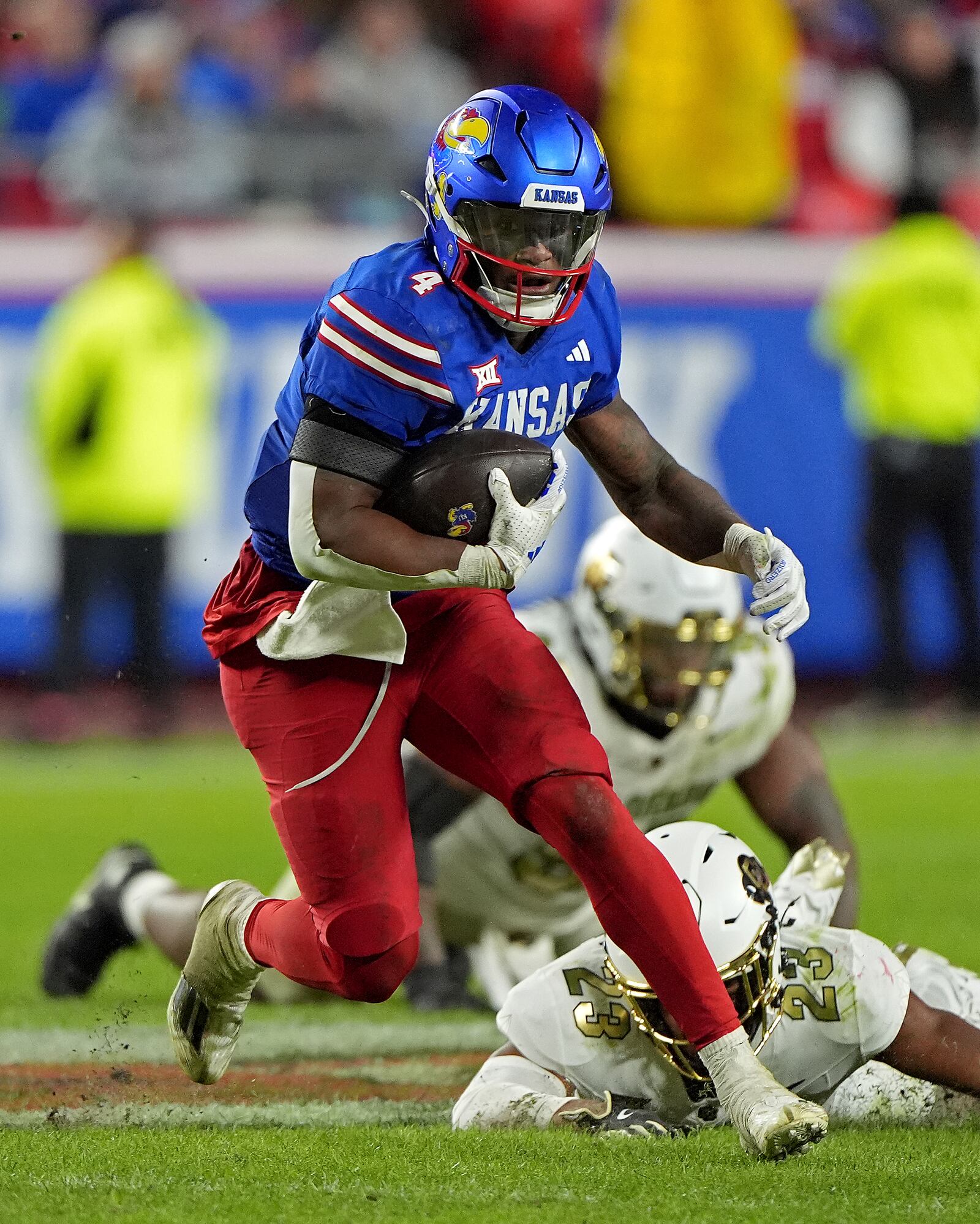 Kansas running back Devin Neal runs the ball during the second half of an NCAA college football game against Colorado, Saturday, Nov. 23, 2024, in Kansas City, Mo. (AP Photo/Charlie Riedel)