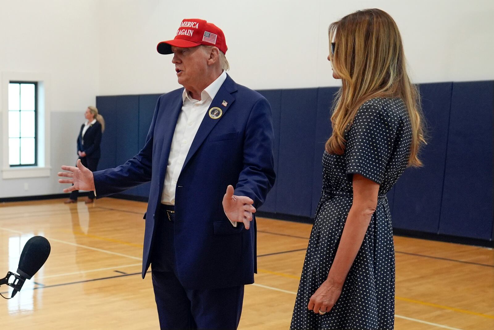 Republican presidential nominee former President Donald Trump speaks as former first lady Melania Trump listens after they voted on Election Day at the Morton and Barbara Mandel Recreation Center, Tuesday, Nov. 5, 2024, in Palm Beach, Fla. (AP Photo/Evan Vucci)