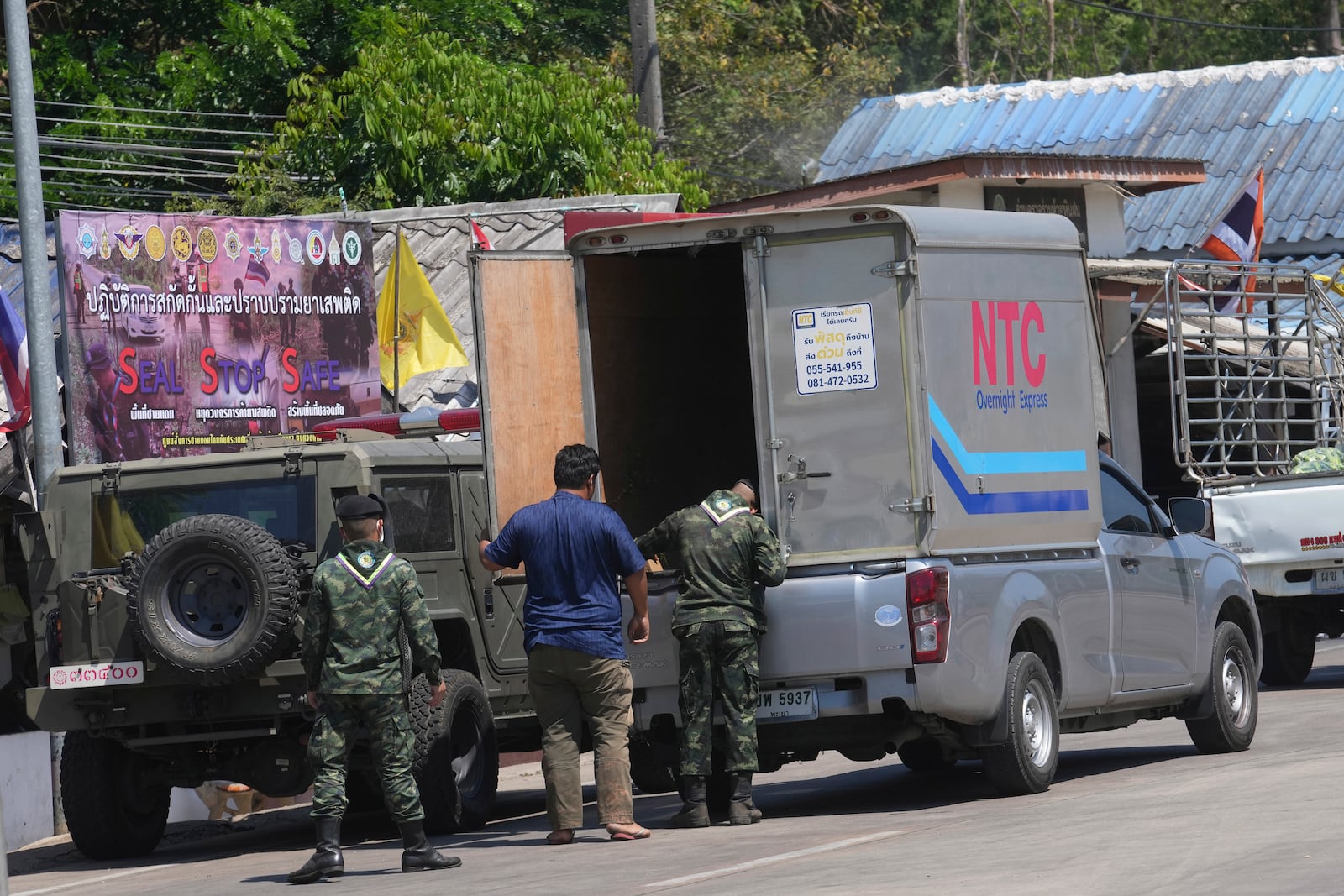 A Thai soldier inspects a truck at a checkpoint to prevent trafficking along the border with Myanmar in Mae Sot, Thailand Wednesday, Feb. 26, 2025. (AP Photo/Sakchai Lalit)