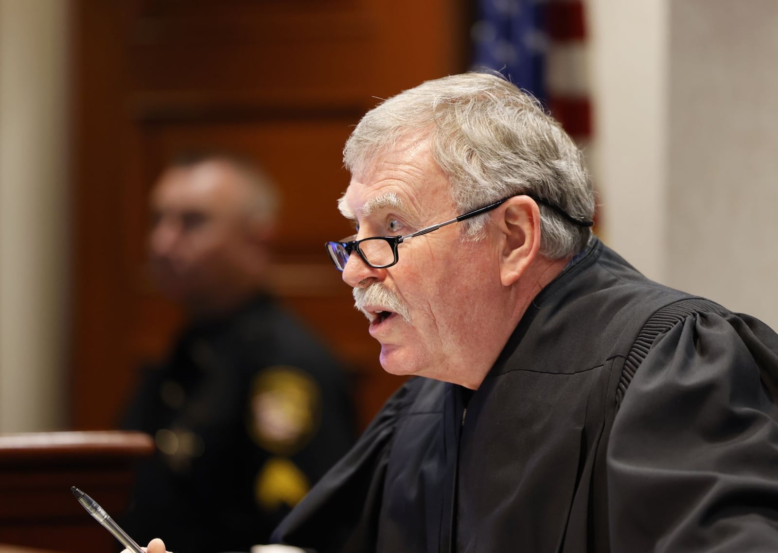 Visiting Judge Daniel Hogan speaks during arraignment of Butler County Auditor Roger Reynolds in Butler County Common Pleas Court Thursday, Feb. 24, 2022 in Hamilton. Reynolds pleaded not guilty to all charges including bribery, two counts of unlawful interest in a public contract and misdemeanor charges of unlawful use of authority and conflict of interest. The charges stem from allegations that Reynolds used his public office to further his own interests. NICK GRAHAM/STAFF