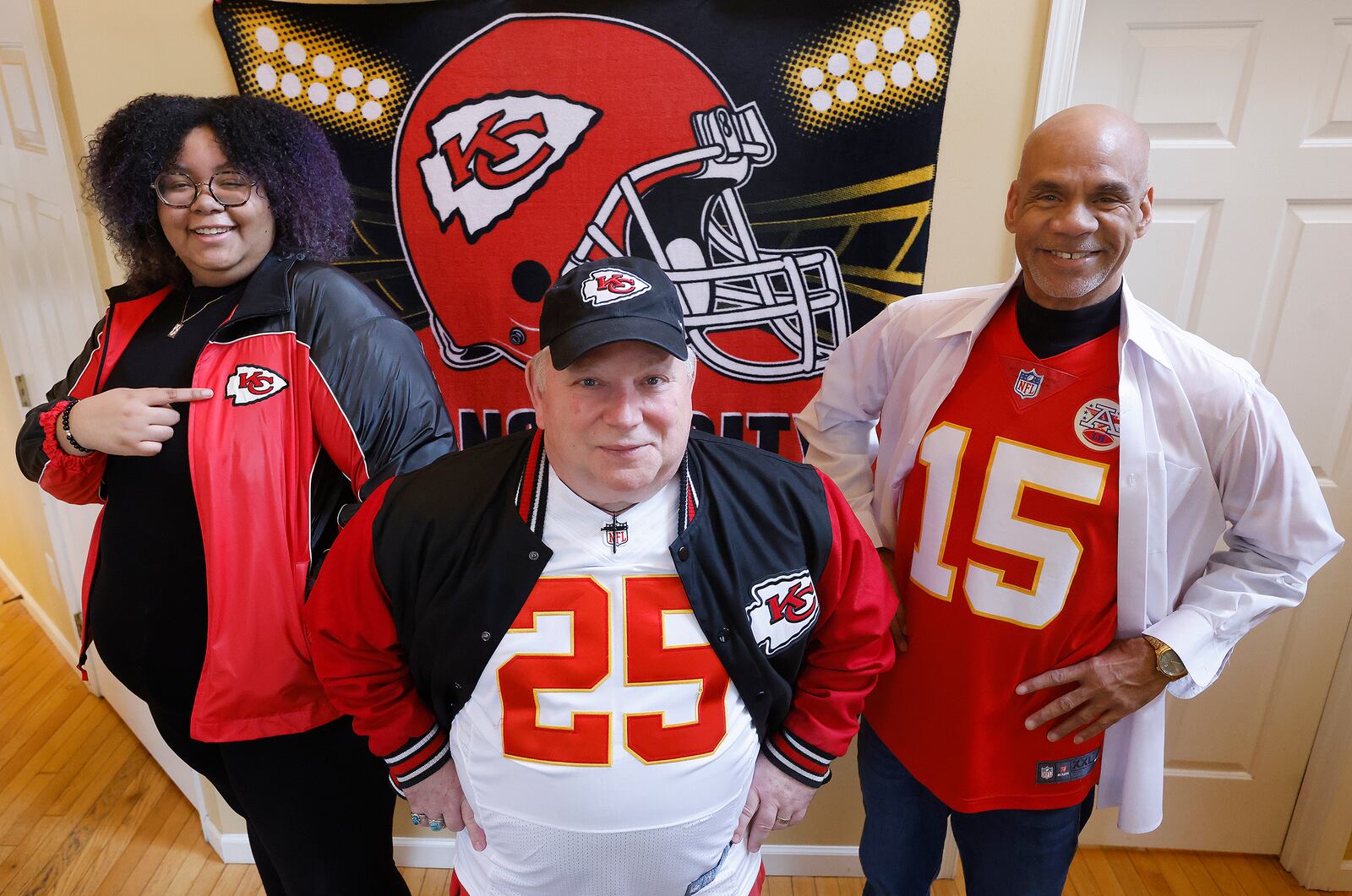 Kansas City Chiefs super fans, from left, Kae Townsend, of Clayton, Tim Roberts and Sylvester Townsend have all rooted for the team all their lives. MARSHALL GORBY/STAFF