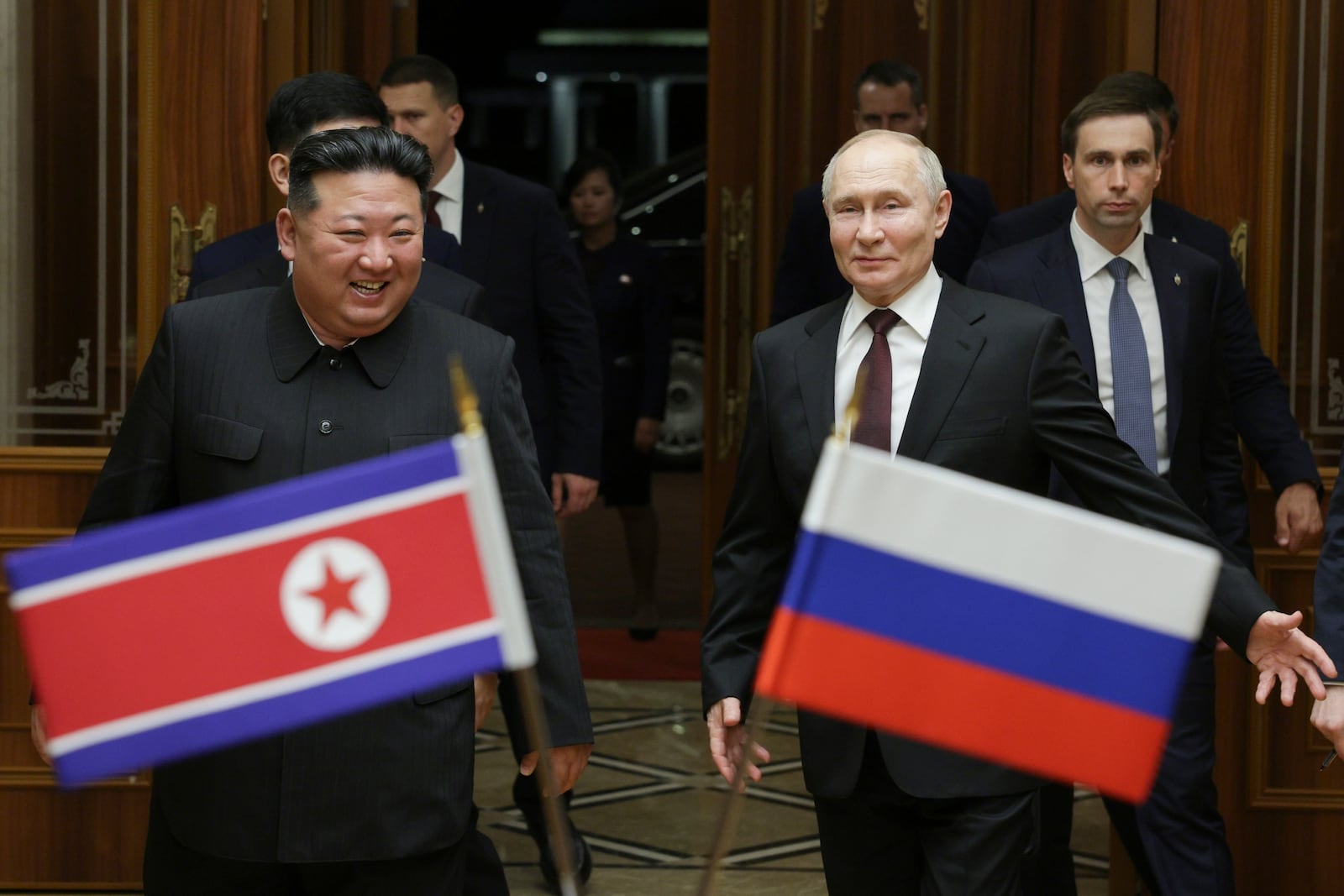 FILE - Russian President Vladimir Putin, right, and North Korea's leader Kim Jong Un smile during their meeting at the Pyongyang Sunan International Airport outside Pyongyang, North Korea, on June 19, 2024. (Gavriil Grigorov, Sputnik, Kremlin Pool Photo via AP, File)