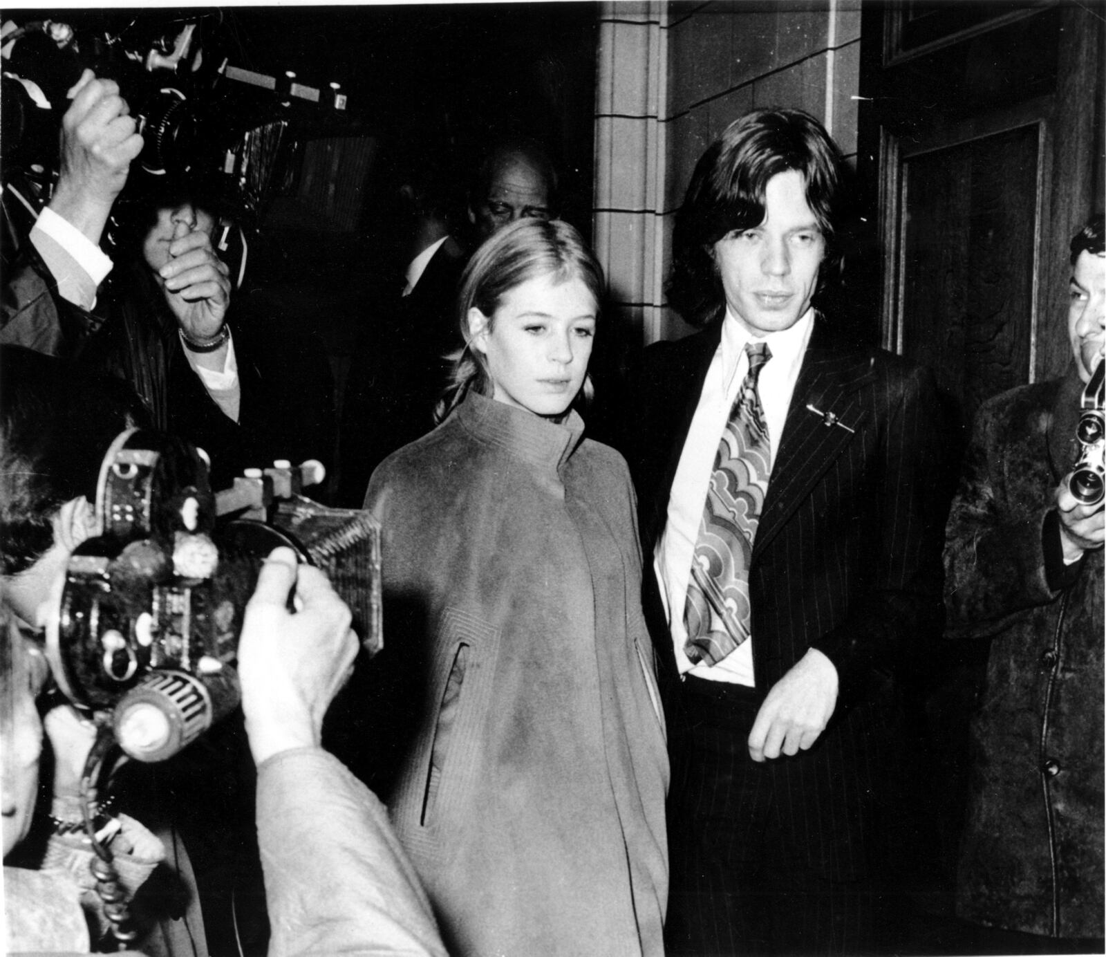 FILE - Mick Jagger, lead singer of The Rolling Stones, and singer Marianne Faithfull appear at Marlborough St. Court for possession of marijuana, in London, England, June 23, 1969. (AP Photo/Eddie Worth, File)