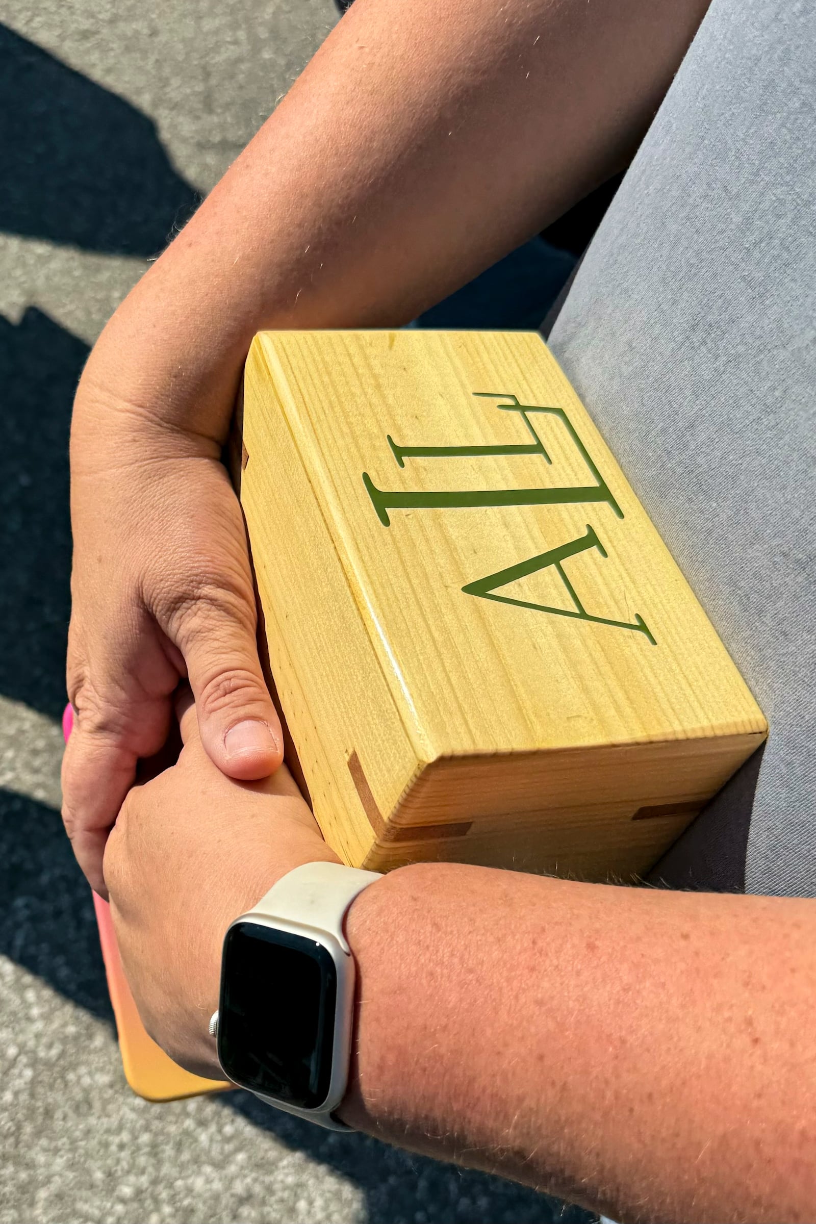 Shannon Doughty holds a wooden box on Aug. 29, 2024, in Westfield, Indiana, that had contained some of the cremated remains of her late brother, Allen Livingston, who was identified in October 2023 as the ninth known victim of suspected serial killer Herbert Baumeister. (AP Photo/Rick Callahan)