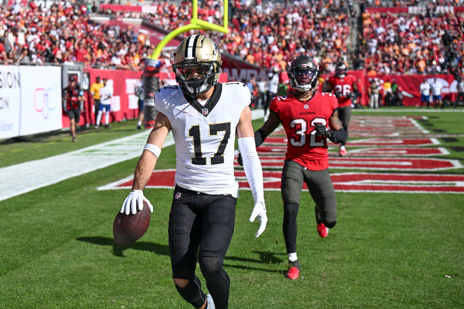 New Orleans Saints wide receiver Dante Pettis (17) pulls in a touchdown reception during the first half of an NFL football game against the Tampa Bay Buccaneers Sunday, Jan. 5, 2025, in Tampa, Fla. (AP Photo/Jason Behnken)