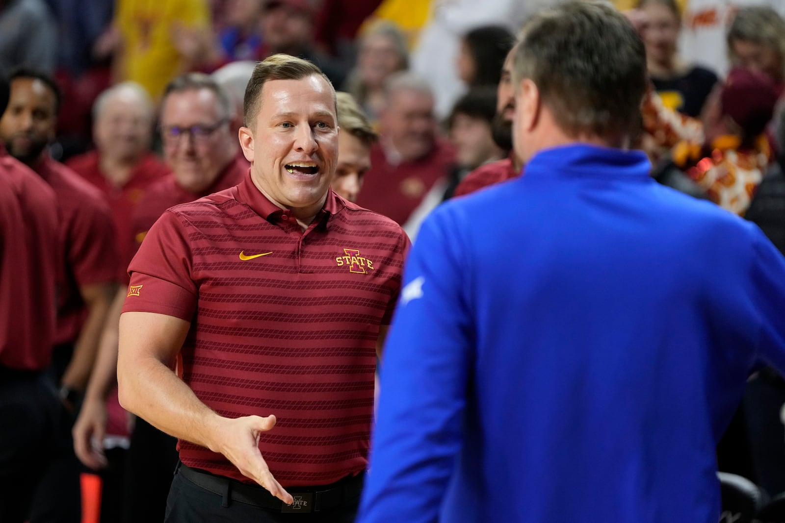 Iowa State head coach T.J. Otzelberger, left, greets Kansas head coach Bill Self before an NCAA college basketball game Wednesday, Jan. 15, 2025, in Ames, Iowa. (AP Photo/Charlie Neibergall)