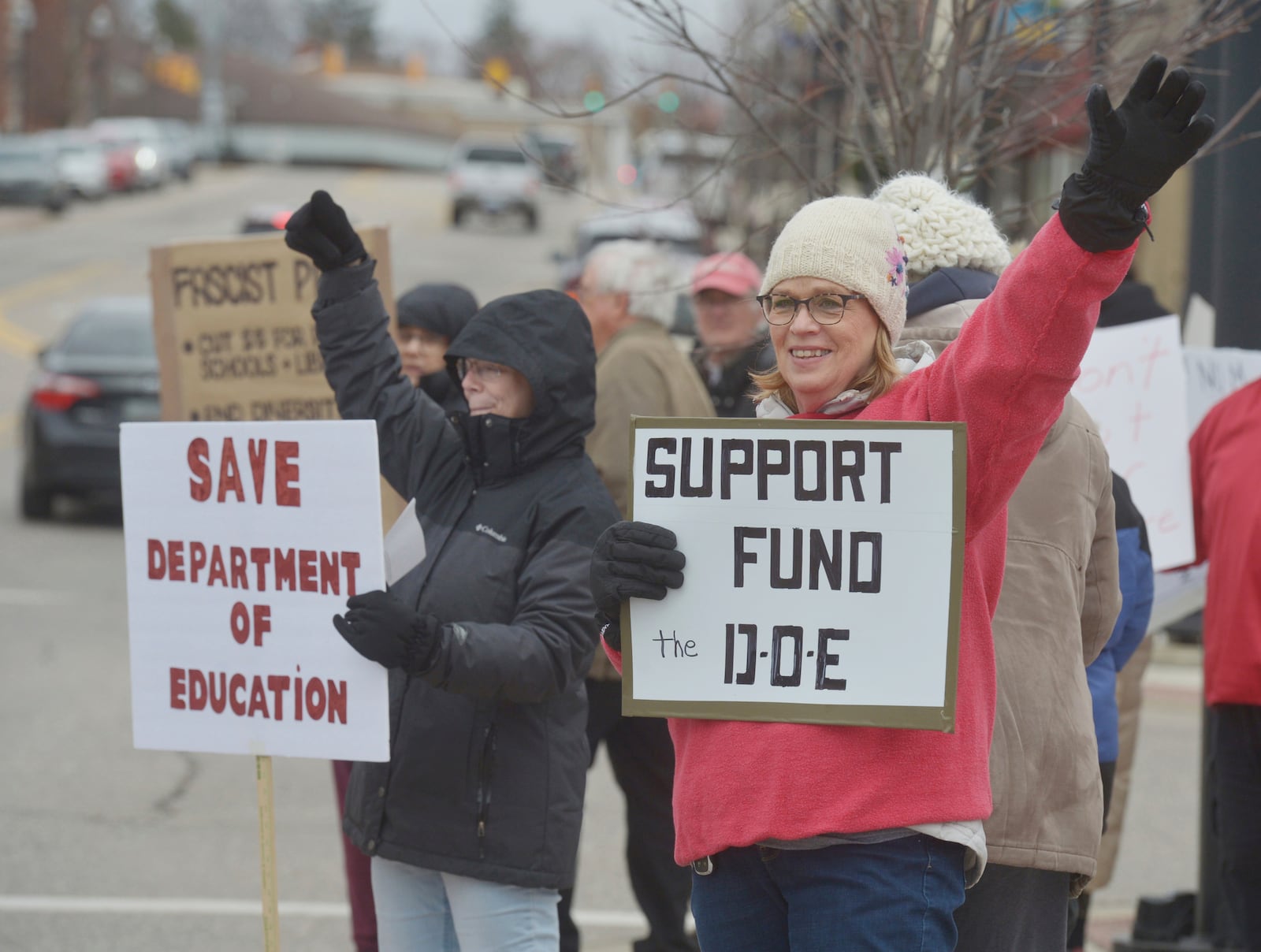 Kay May joins dozens of people gathered in downtown Niles, Mich., Thursday, March 20, 2025, to protest recent government cuts in the Department of Education. (Don Campbell/The Herald-Palladium via AP)