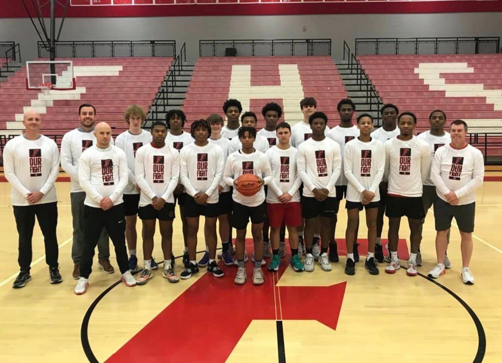 The 2023 Fairfield High School boys basketball team on March 4, 2023 wore shirts that said "Our Fight" in honor of long-time sports volunteer Sharon Revel, who has cancer. CONTRIBUTED/FAIRFIELD SCHOOLS