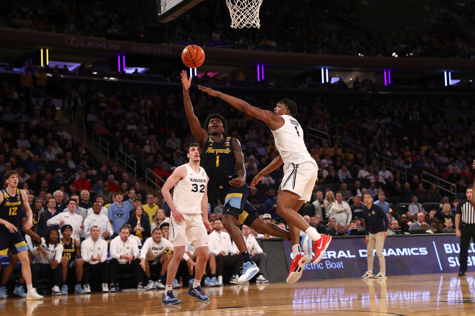 Marquette guard Kam Jones (1) shoots the ball during the second half of an NCAA college basketball game against Xavier in the quarterfinals of the Big East Conference tournament, Thursday, March 13, 2025, in New York. (AP Photo/Pamela Smith)