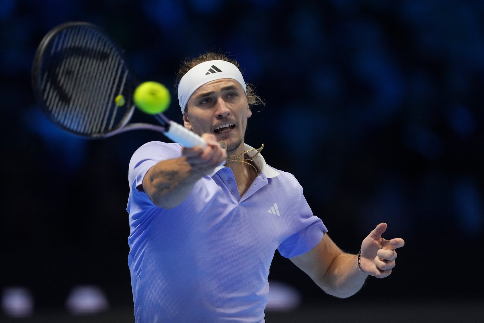 Germany's Alexander Zverev returns to Taylor Fritz of the United States during their semifinal tennis match of the ATP World Tour Finals at the Inalpi Arena in Turin, Italy, Saturday, Nov. 16, 2024. (AP Photo/Antonio Calanni)