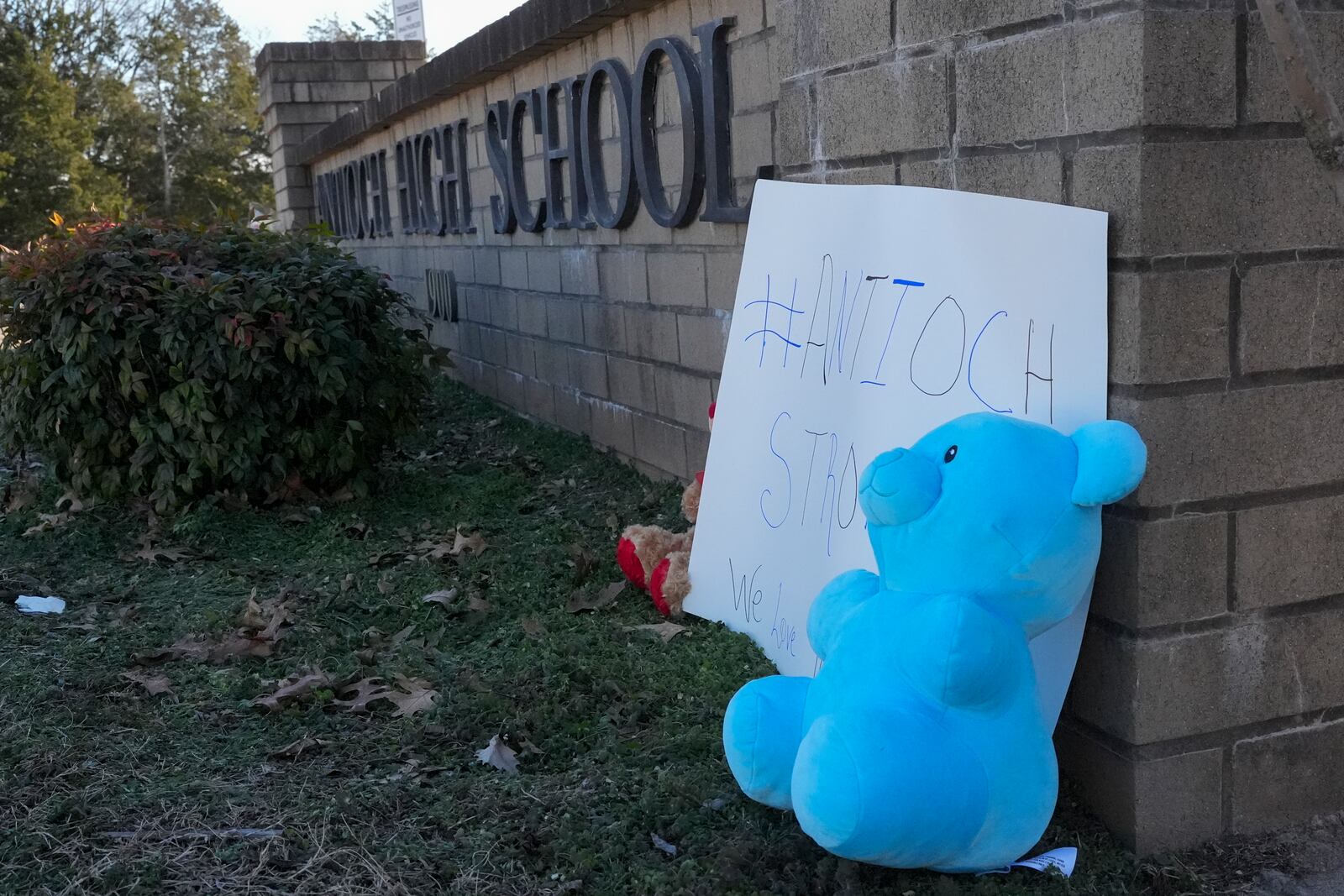 A stuffed bear sits at a memorial for victims of a shooting at Antioch High School, Thursday, Jan. 23, 2025, in Nashville, Tenn. (AP Photo/George Walker IV)