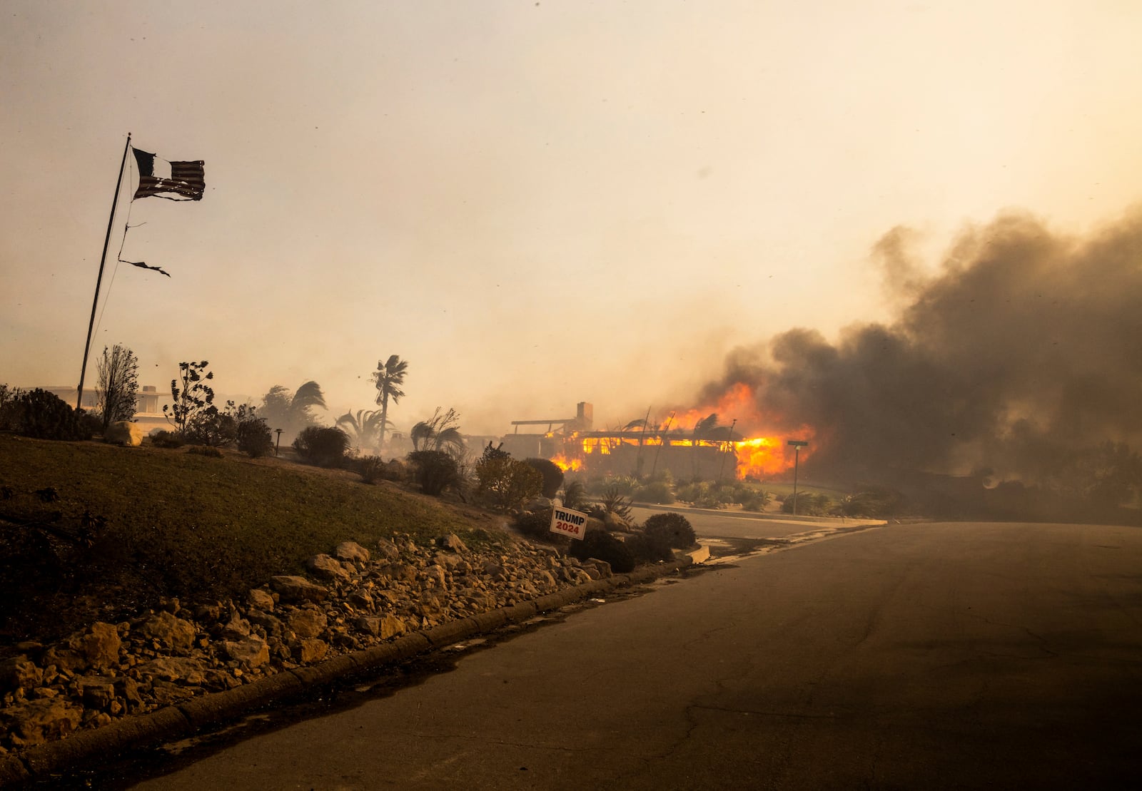 A home burns in the Mountain fire, Wednesday, Nov. 6, 2024, near Camarillo, Calif. (AP Photo/Ethan Swope)