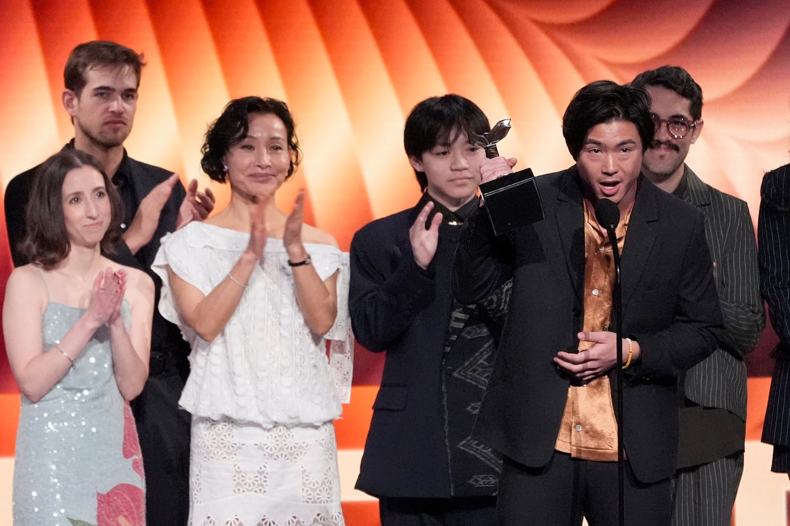 Arielle Zakowski, from left, Samuel Davis, Joan Chen, , Izac Wang, Sean Wang, and Carlos Lopez Estrada accept the best first feature award for "Didi" during the Film Independent Spirit Awards on Saturday, Feb. 22, 2025, in Santa Monica, Calif. (AP Photo/Chris Pizzello)