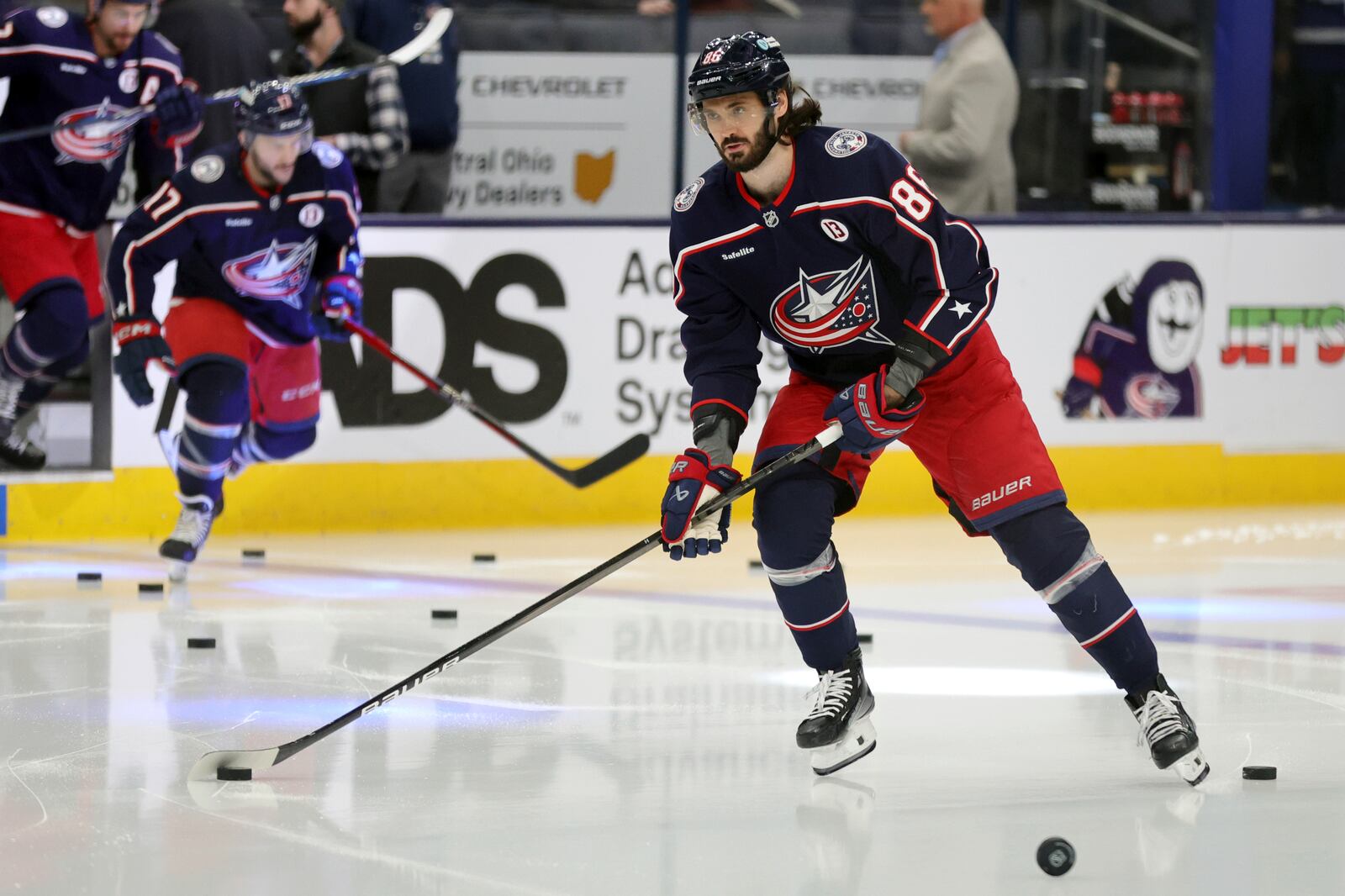 Columbus Blue Jackets forward Kirill Marchenko warms up before an NHL hockey game against the Toronto Maple Leafs in Columbus, Ohio, Tuesday, Oct. 22, 2024. (AP Photo/Paul Vernon)