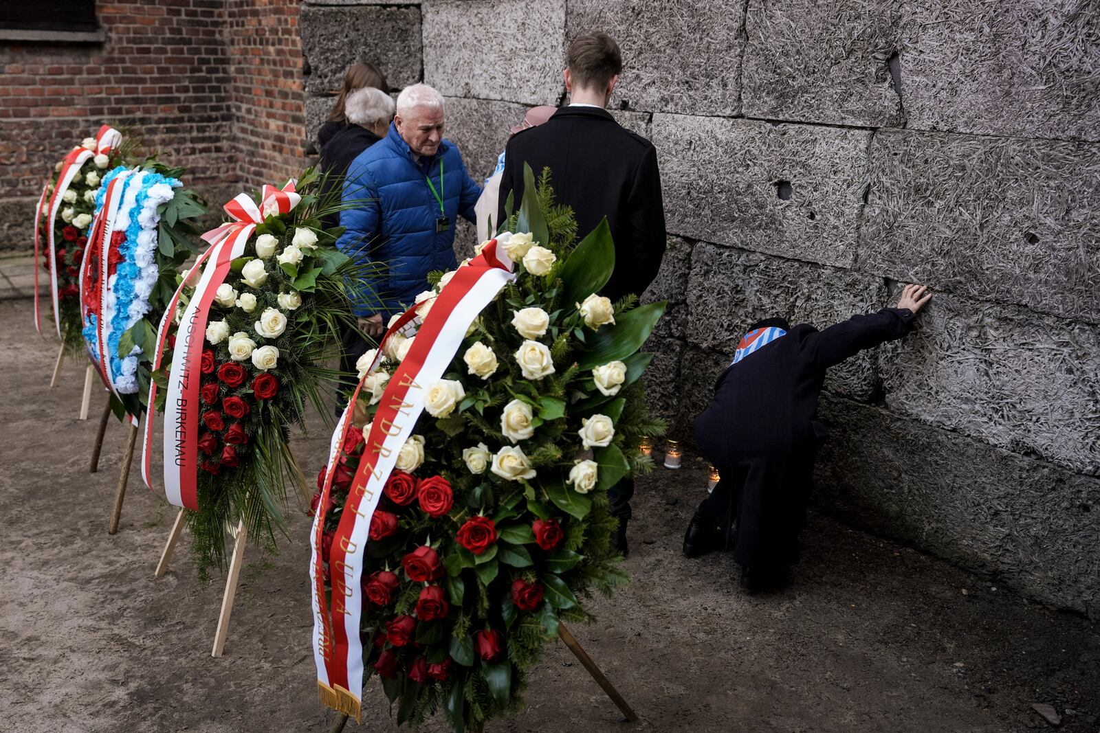 Survivors and relatives attend a ceremony at the Auschwitz-Birkenau former Nazi German concentration and extermination camp, in Oswiecim, Poland, Monday, Jan. 27. 2025.(AP Photo/Oded Balilty)