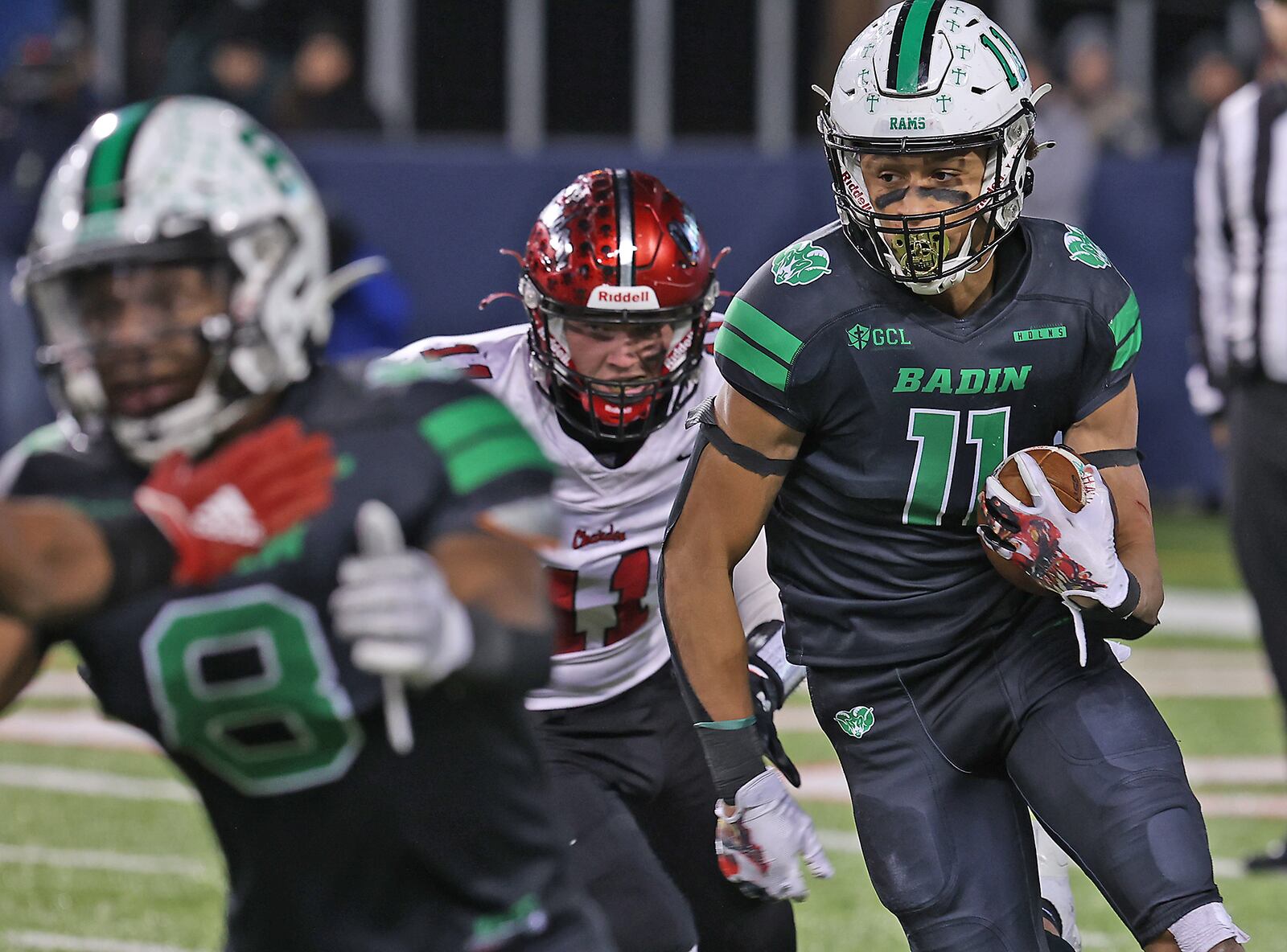 Badin's Braedyn Moore is chased by Chardon's Zoran Vujaklija in the Division III state championship game in Canton on Dec. 3, 2021. BILL LACKEY/STAFF