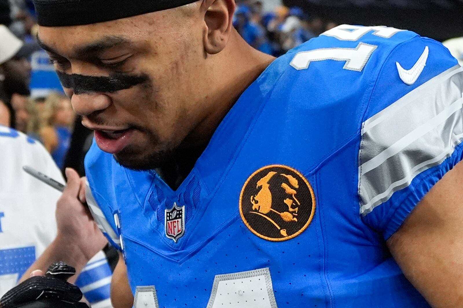 Detroit Lions wide receiver Amon-Ra St. Brown (14) wears a John Madden patch on his jersey for an NFL football game against the Chicago Bears, Sunday, Nov. 17, 2024, in Detroit. (AP Photo/Carlos Osorio)