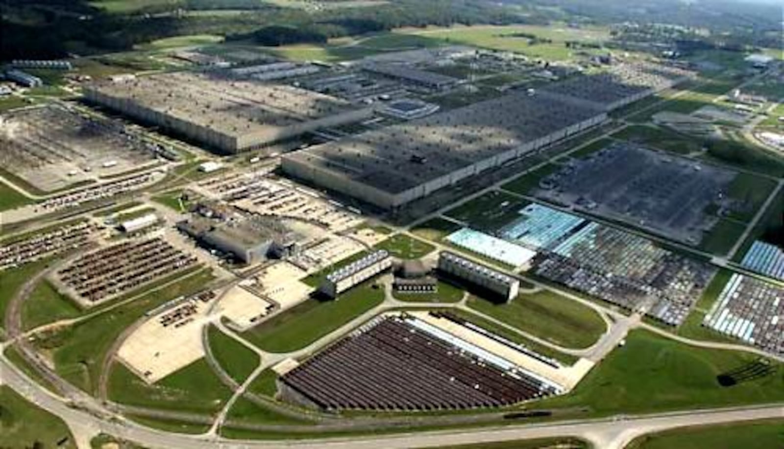 The former Portsmouth Gaseous Diffusion Plant is seen in this Sept. 26, 2006, photo. At bottom right, center and left are seen thousands of cylinders containing radioactive waste.