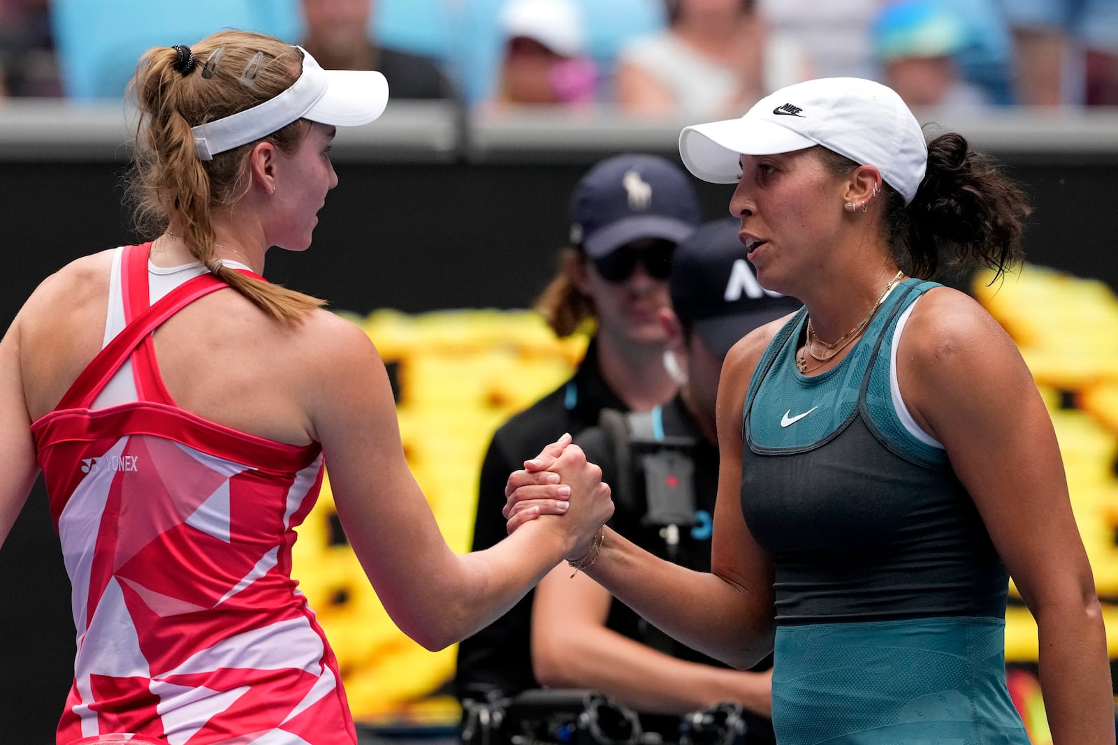 Madison Keys, right, of the U.S. is congratulated by Elena Rybakina of Kazakhstan following their fourth round match at the Australian Open tennis championship in Melbourne, Australia, Monday, Jan. 20, 2025. (AP Photo/Manish Swarup)