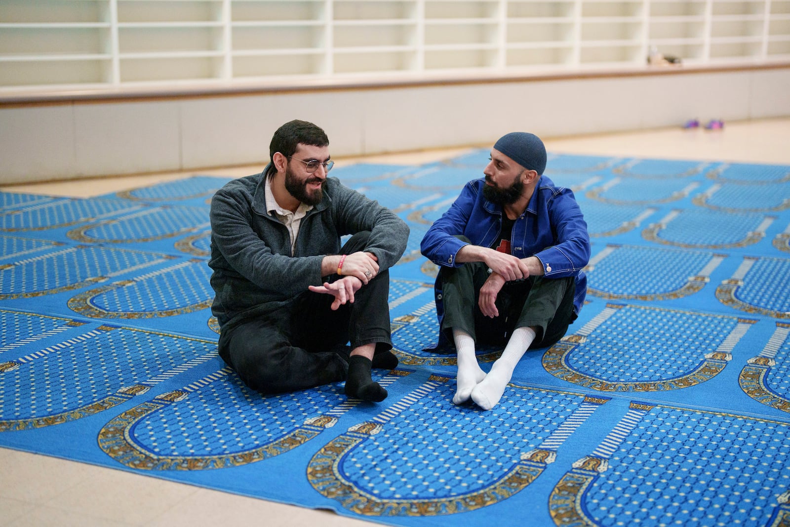 Mohammed AlDajani, left, and Salah Eddine Benatia talk during a community gathering to discuss plans for Ramadan for members of Masjid Al-Taqwa held at a school in Pasadena, California, Saturday, Feb. 15, 2025. (AP Photo/Eric Thayer)