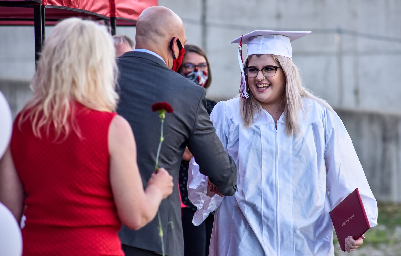 Madison High School drive-thru graduation ceremony at Land of Illusion