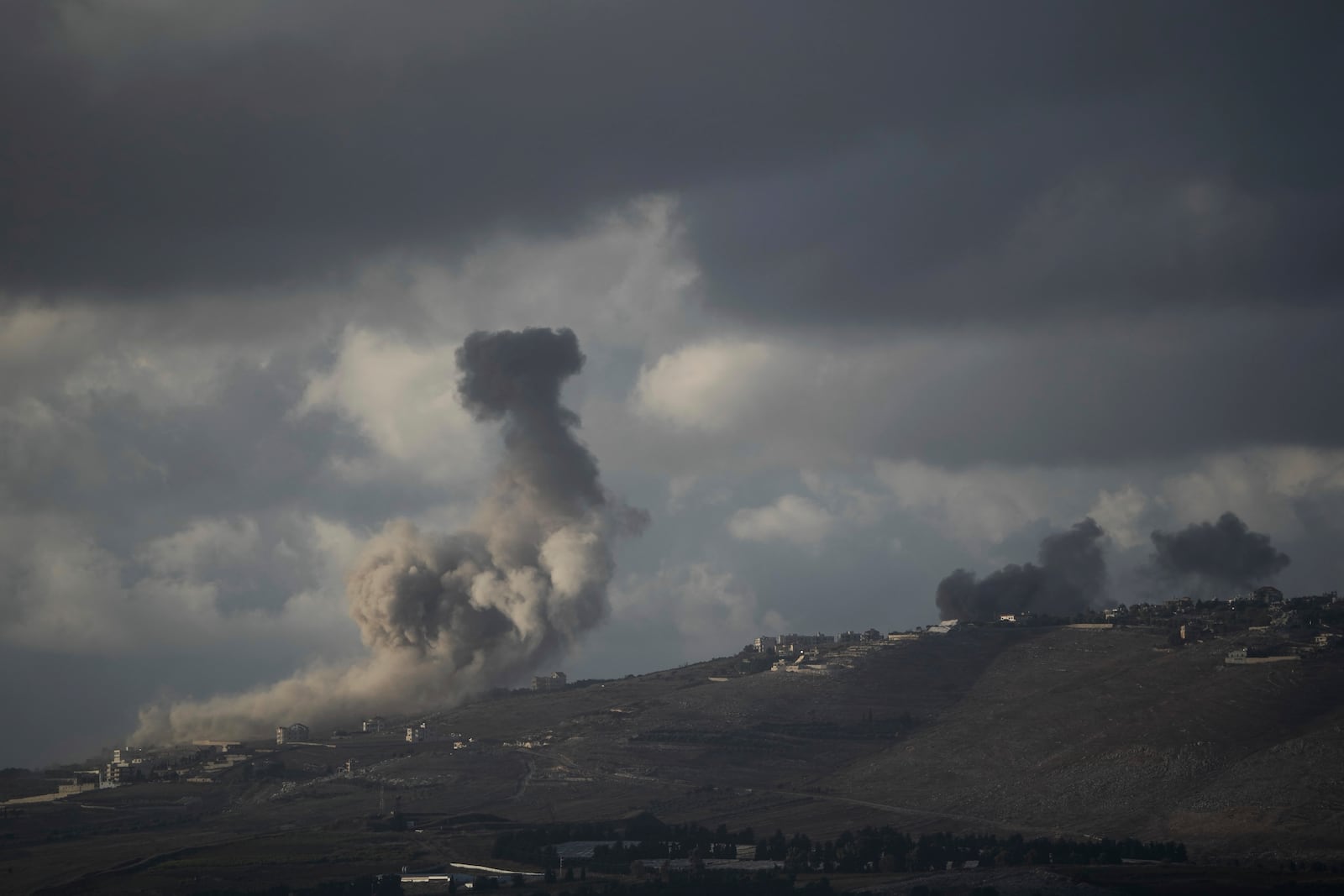 Smoke rises following Israeli bombardment in southern Lebanon as seen from northern Israel, Tuesday, Oct. 1, 2024. (AP Photo/Leo Correa)