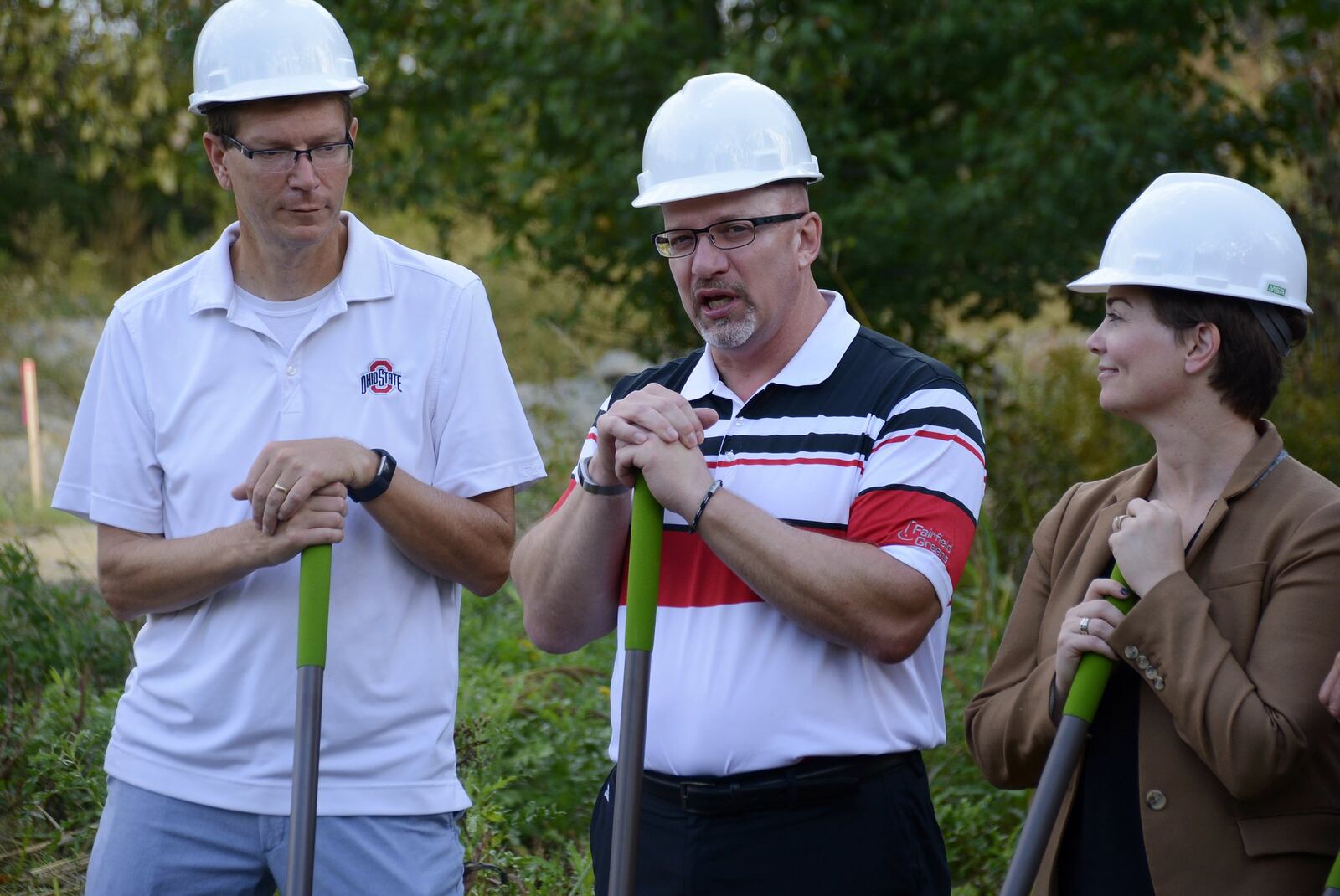 The city of Fairfield broke ground Saturday morning, Oct. 6, 2018, on its new dog park on River Road, just south of Marsh Park, on a 6.5-acre parcel. Pictured is Fairfield Parks Board chair Doug Meece, center, speaking during the groundbreaking ceremony. Also pictured are city engineer Ben Mann and Parks board member and Fairfield School Board member Carrie O’Neal. MICHAEL D. PITMAN/STAFF