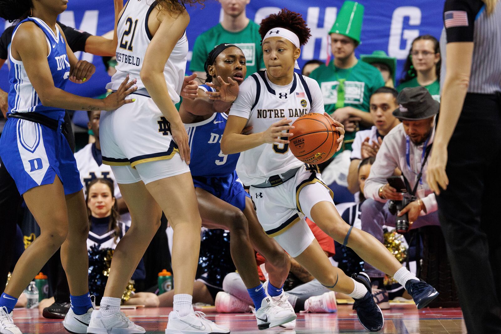 Notre Dame's Hannah Hidalgo (3) handles the ball as Duke's Oluchi Okananwa (5) defends during the second half of an NCAA college basketball game in the semifinals of the Atlantic Coast Conference tournament in Greensboro, N.C., Saturday, March 8, 2025. (AP Photo/Ben McKeown)