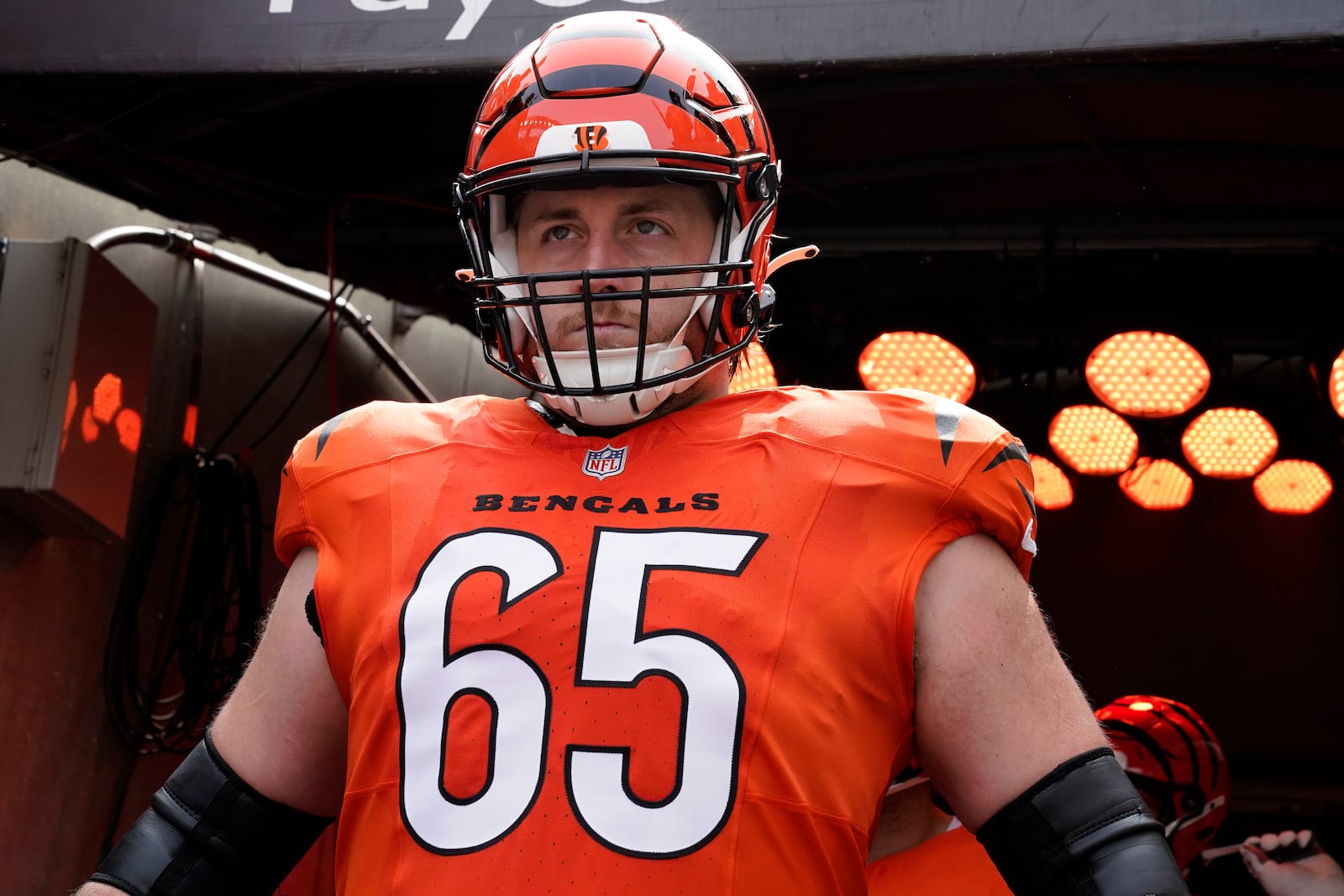 Cincinnati Bengals guard Alex Cappa (65) waits to run onto the field before an NFL football game against the New England Patriots, Sunday, Sept. 8, 2024, in Cincinnati. (AP Photo/Jeff Dean)