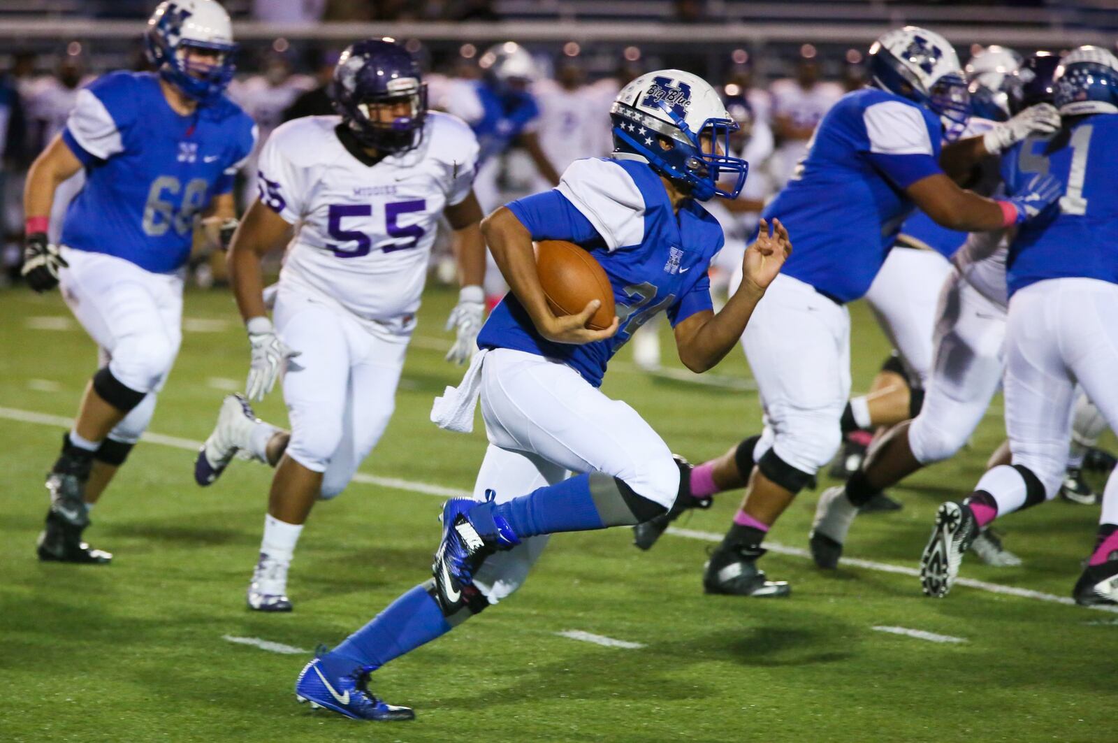 Hamilton running back Zach Reese (34) runs through an opening during a game against Middletown at Virgil Schwarm Stadium in Hamilton on Oct. 21, 2016. GREG LYNCH/STAFF