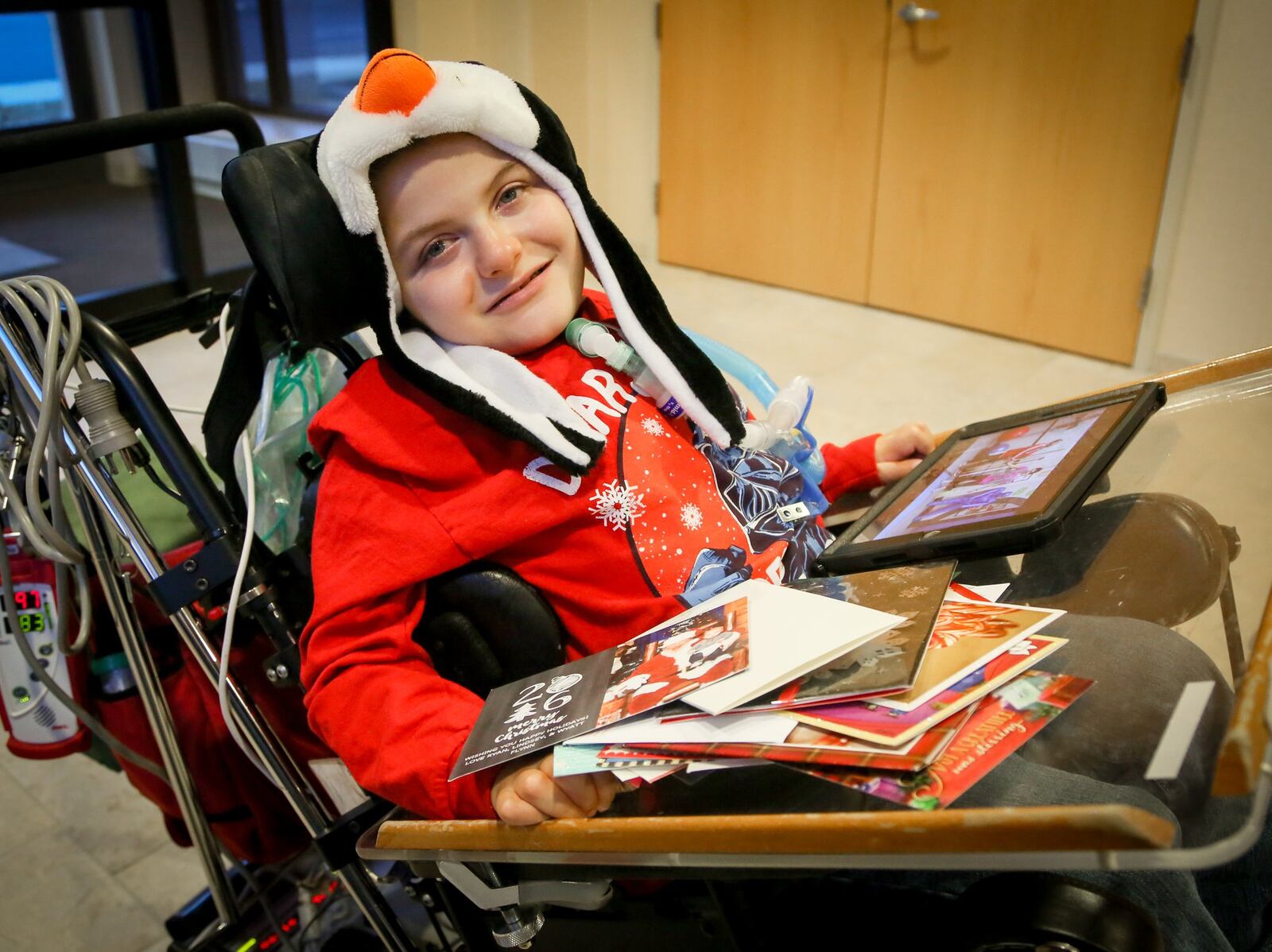 All Andrew Little, 8, wants for Christmas is enough holiday cards to cover the walls of his room at St. Joseph Home in Sharonville, and share them with his friends at the facility for wheelchair-bound people with complex medical needs. GREG LYNCH / STAFF